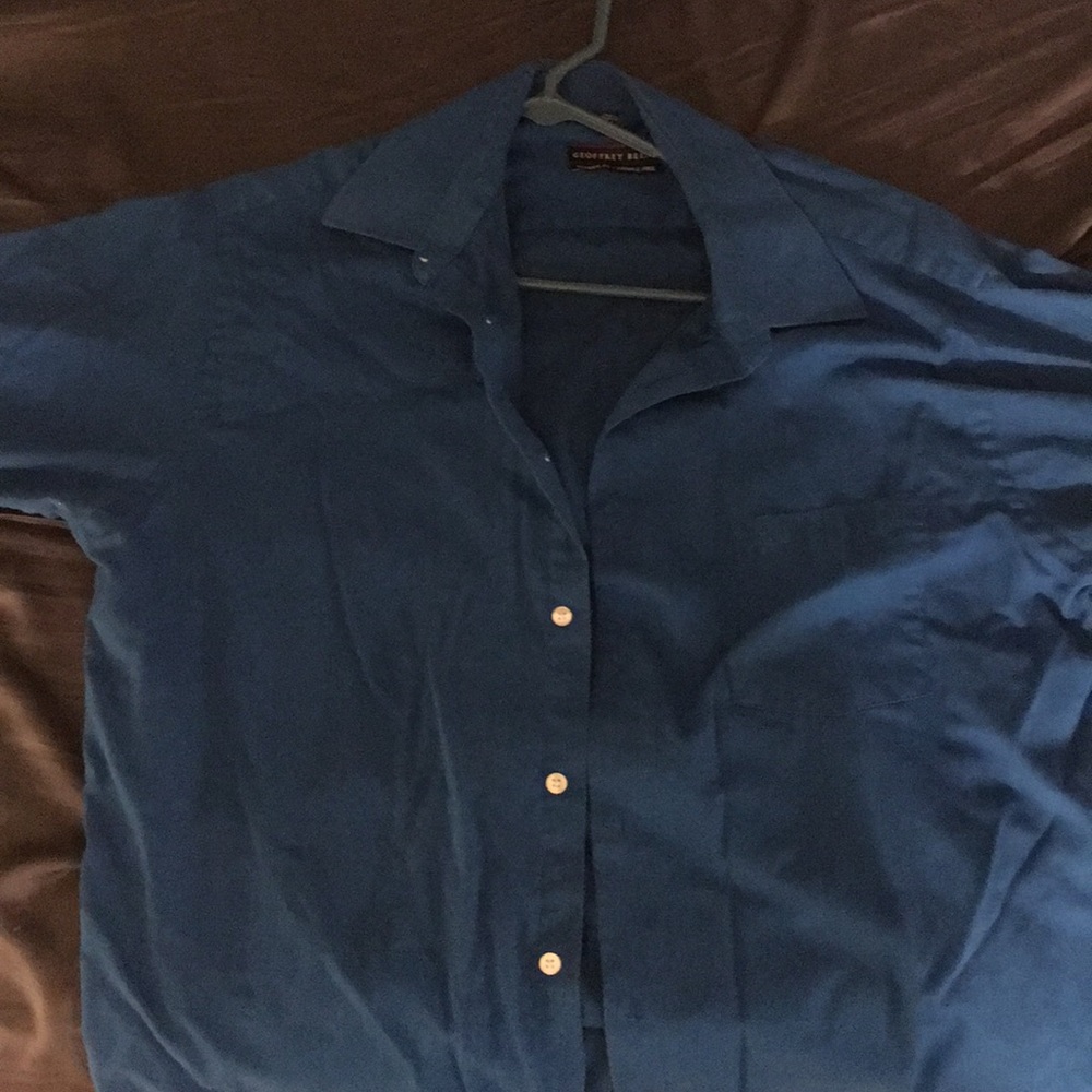 Blue soft button up shirt with white buttons
